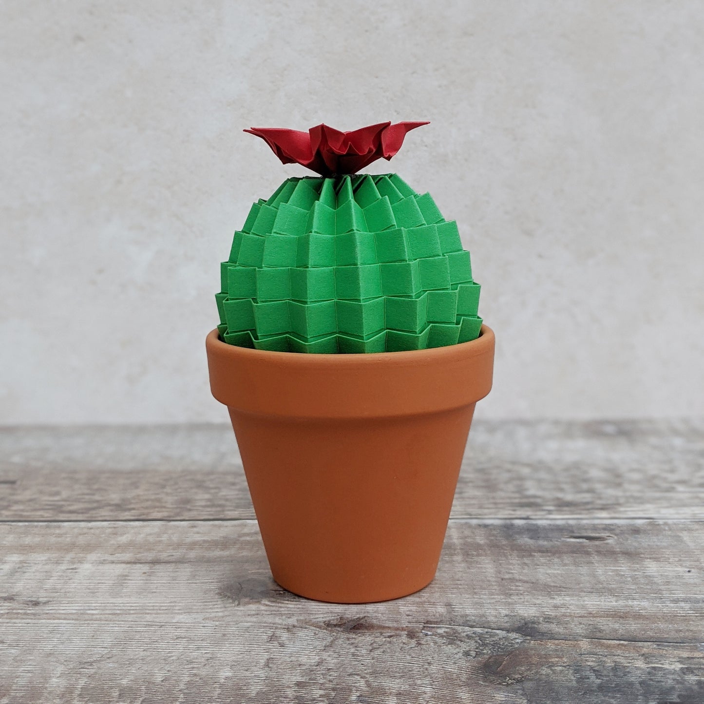 large green paper cactus in terracotta pot with red flower by Origami Blooms
