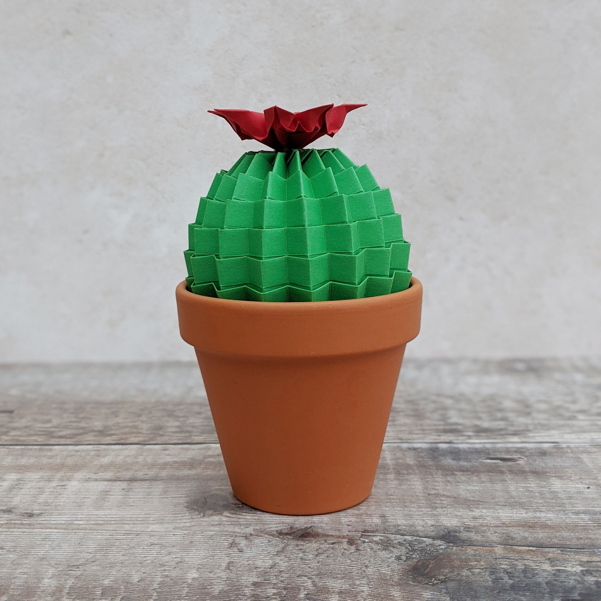 large green paper cactus in terracotta pot with red flower by Origami Blooms
