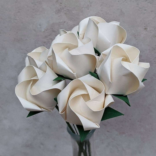 Bouquet of seven ivory origami roses folded from recycled paper