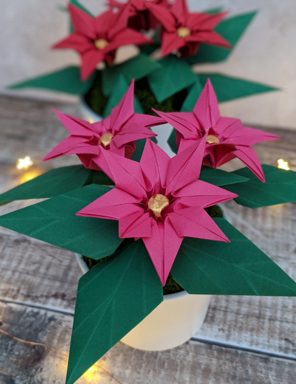 Pink origami paper plant, faux poinsettia in pot