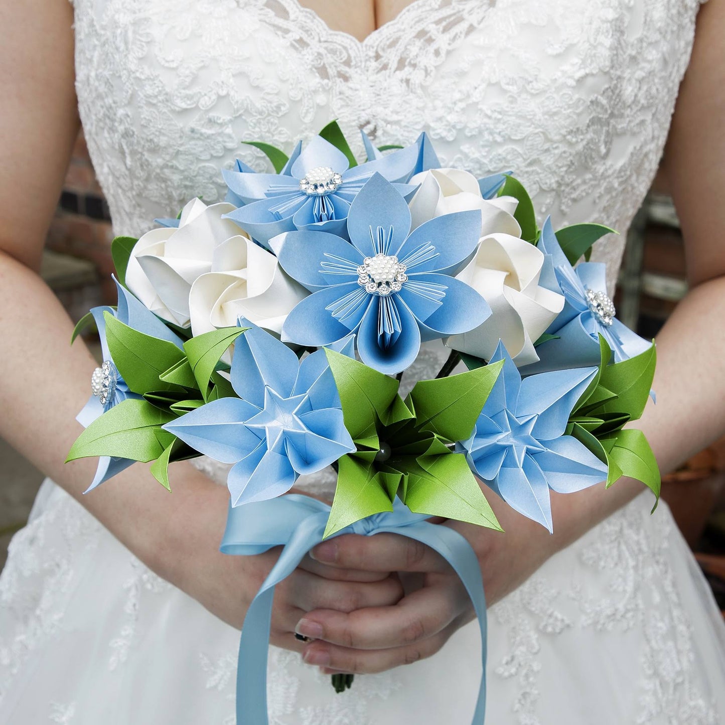 handmade bespoke origami flower bridal bouquet with paper roses, lilies, daisies and starflowers, tied with ribbon