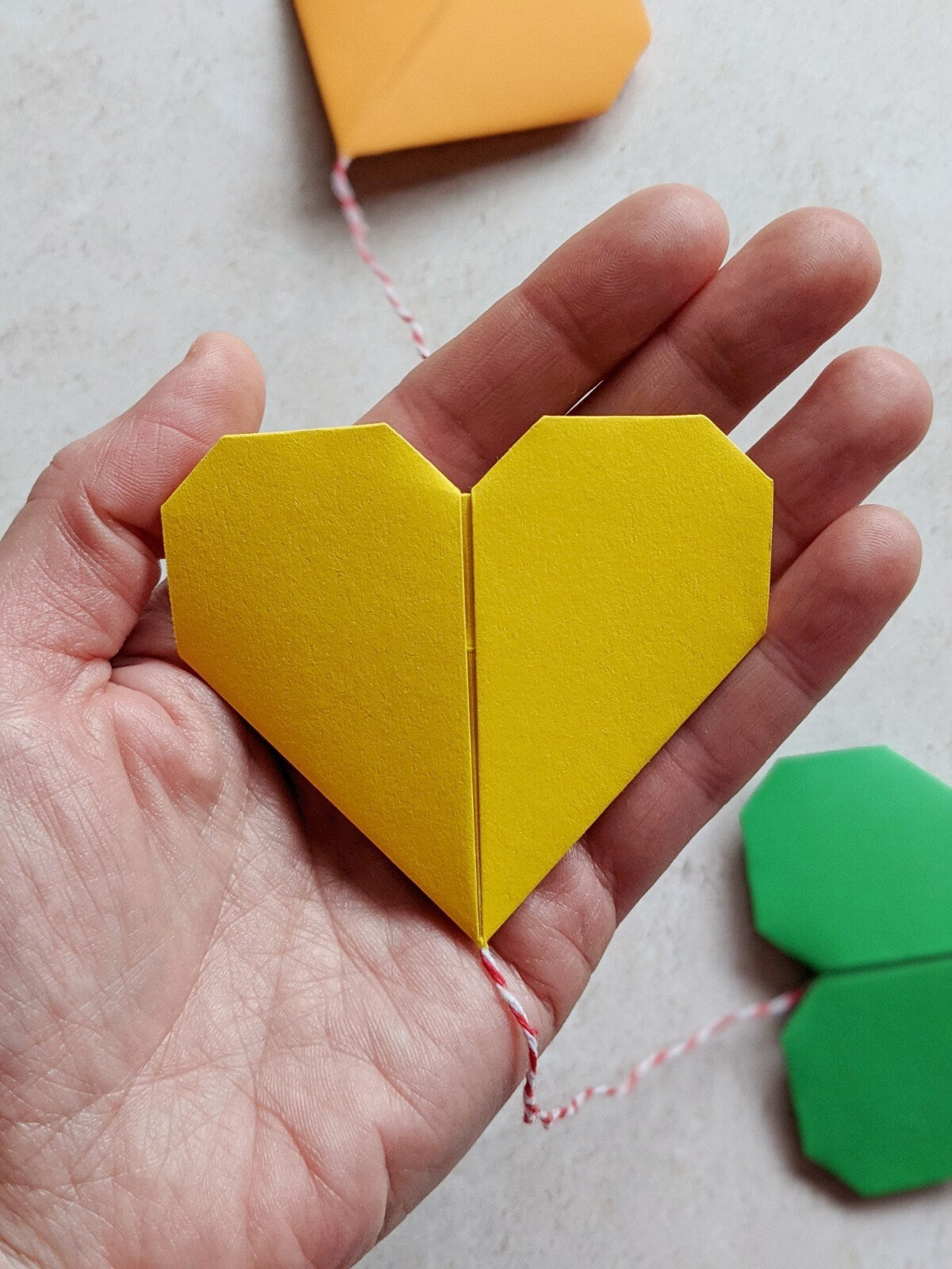 Rainbow origami hearts paper garland, colourful home decoration