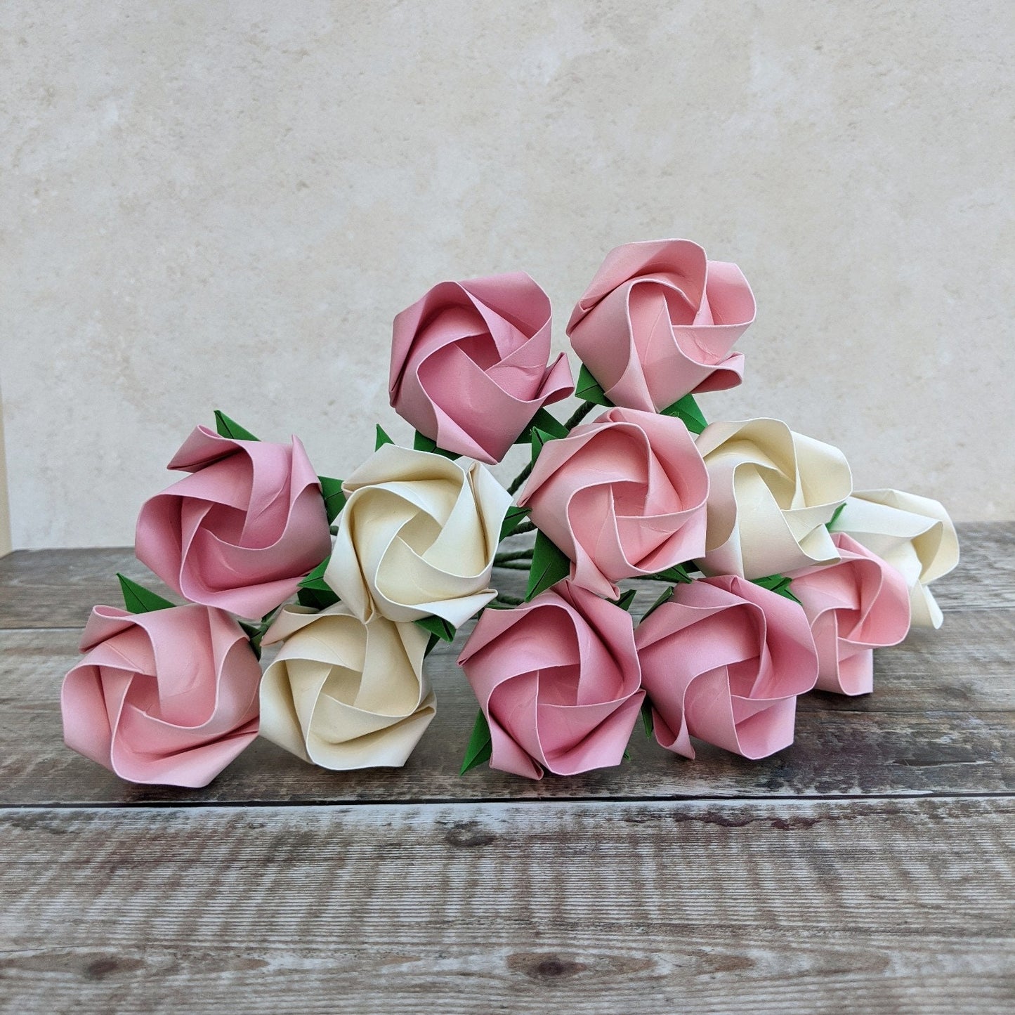 A dozen pastel paper roses, origami flowers bouquet