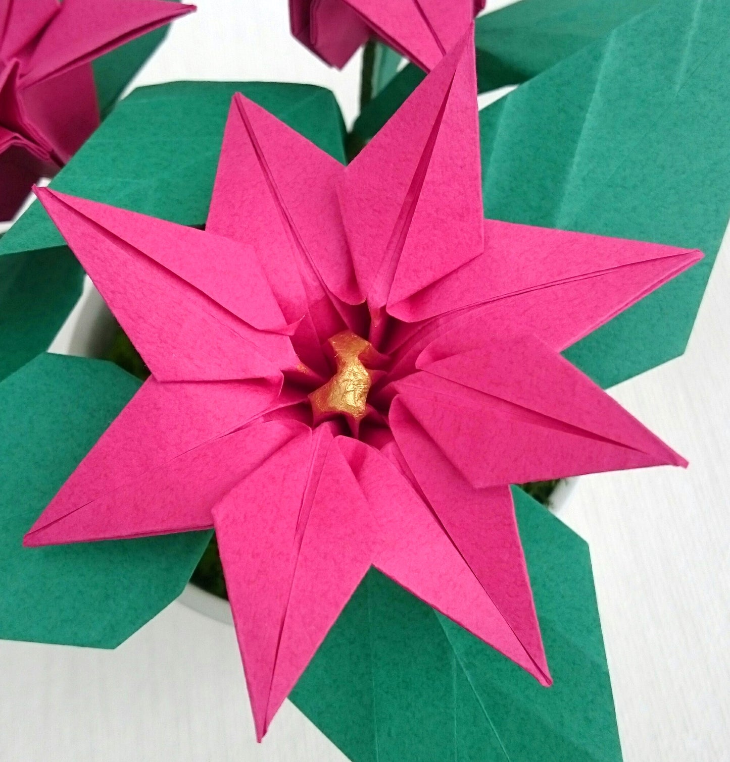 Pink origami paper plant, faux poinsettia in pot