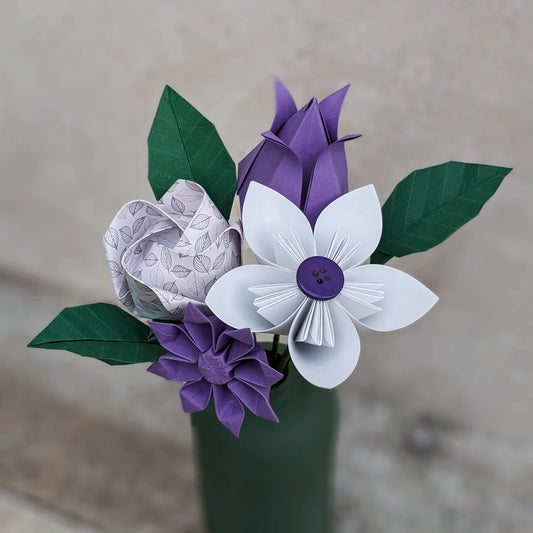Colourful origami paper flower bouquet with leaves