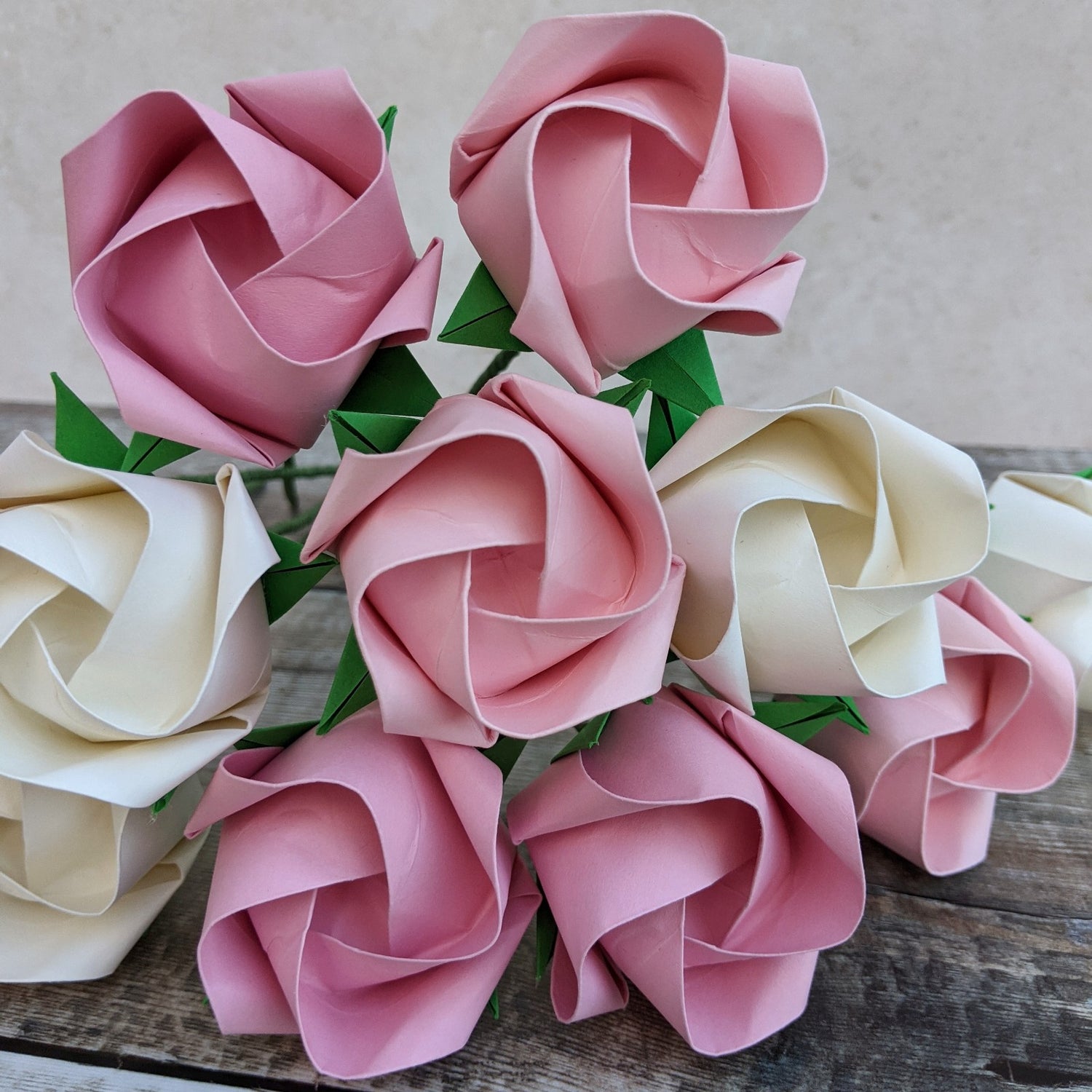 Beautiful big bouquet of a dozen origami paper roses in white and pastel pink