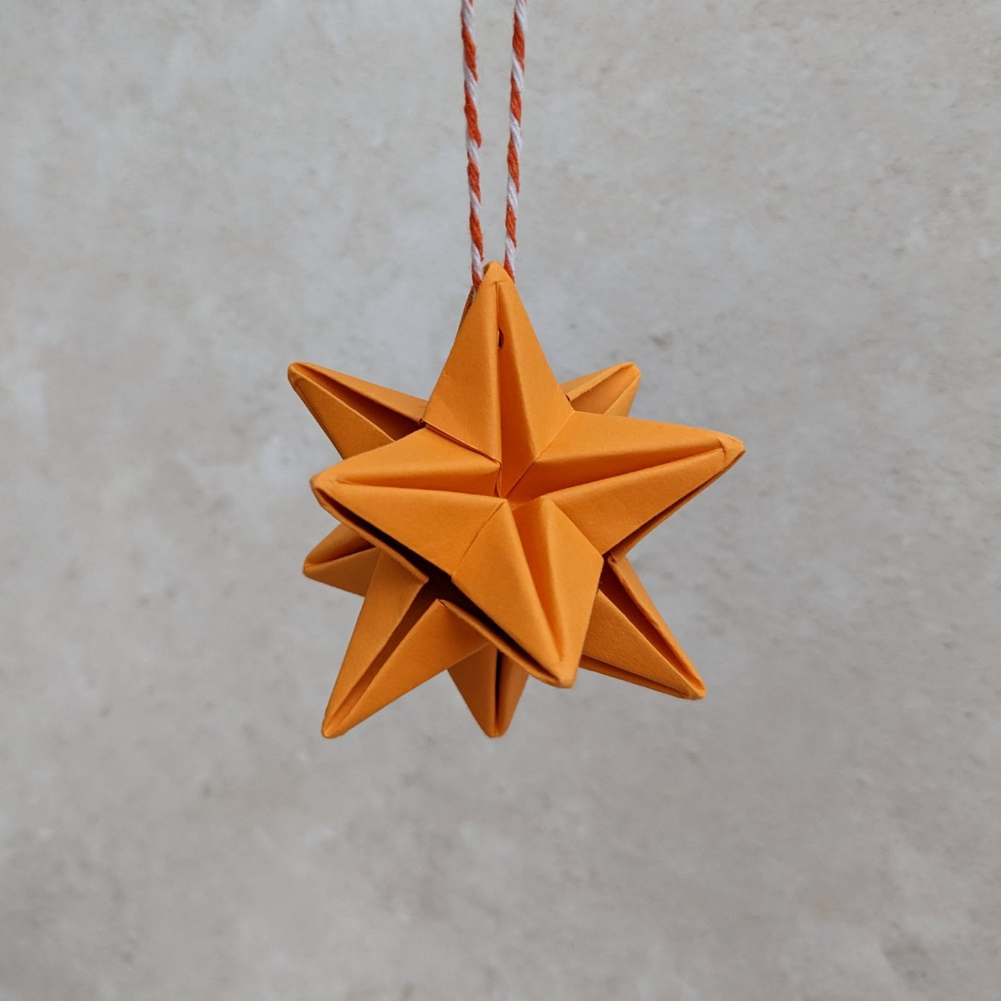 Origami paper star bauble, colourful Christmas tree decoration