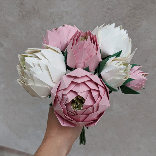 Stunning wedding bouquet with 7 origami peony flowers of various sizes folded from pastel pink and ivory recycled paper