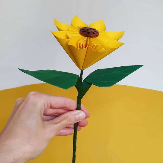 Single paper sunflower  with leaves on long stem by Origami Blooms