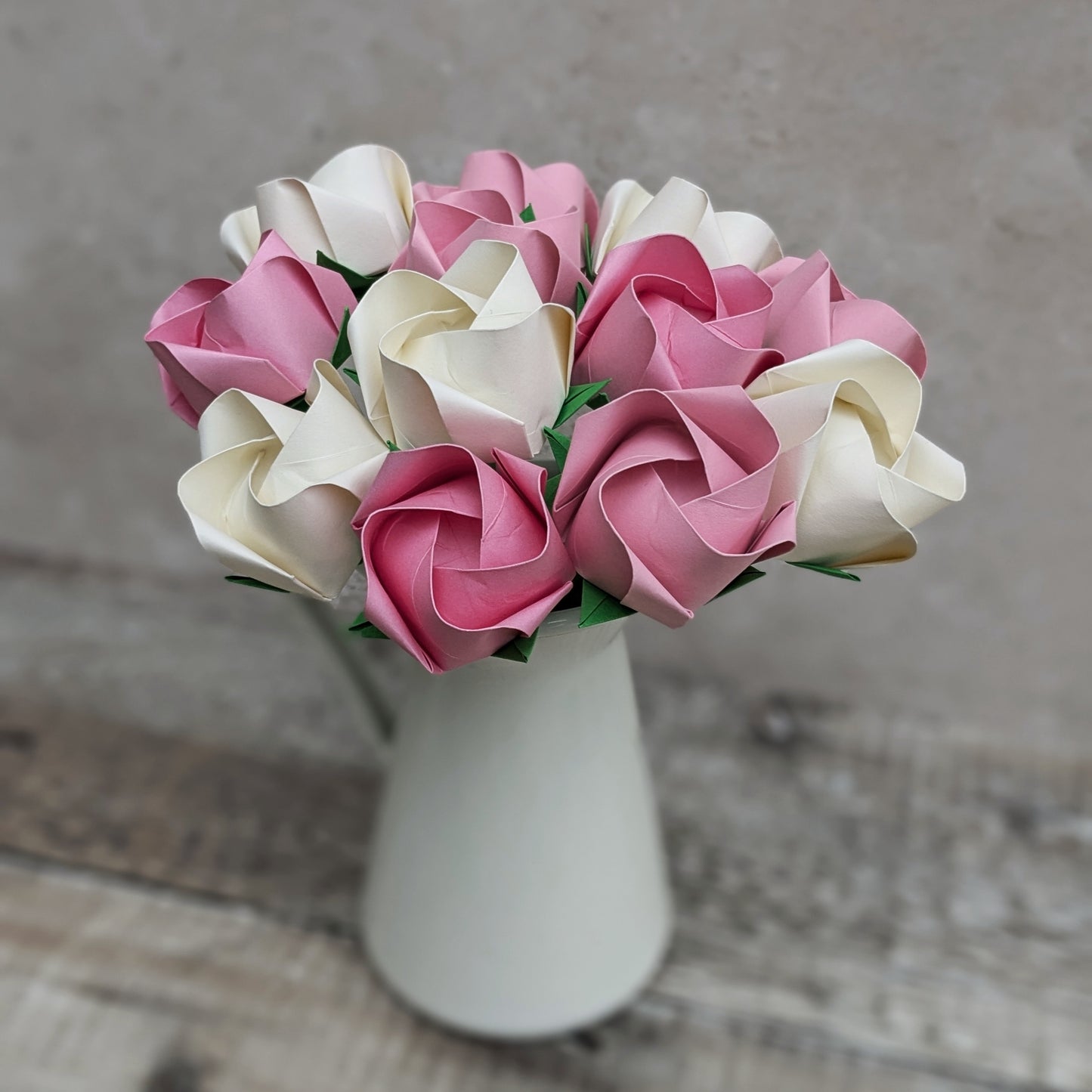 A dozen pastel paper roses, origami flowers bouquet