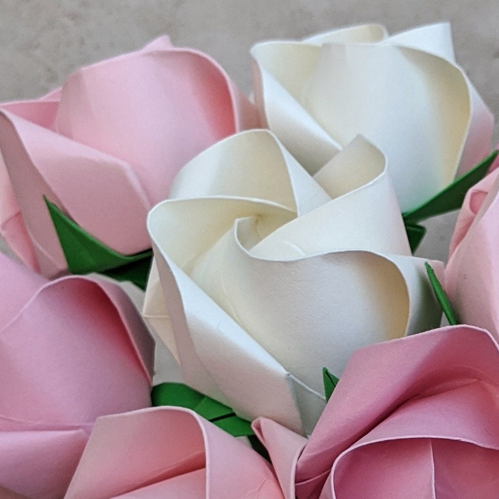 A dozen pastel paper roses, origami flowers bouquet