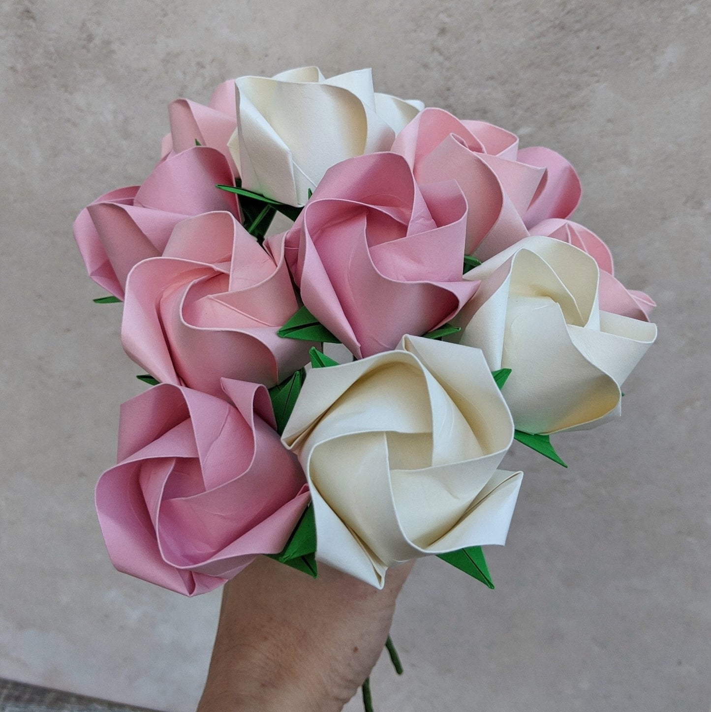 A dozen pastel paper roses, origami flowers bouquet