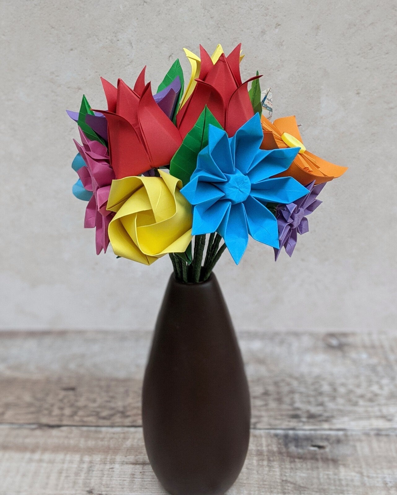 Colourful origami wedding bouquet with upcycled map paper flowers