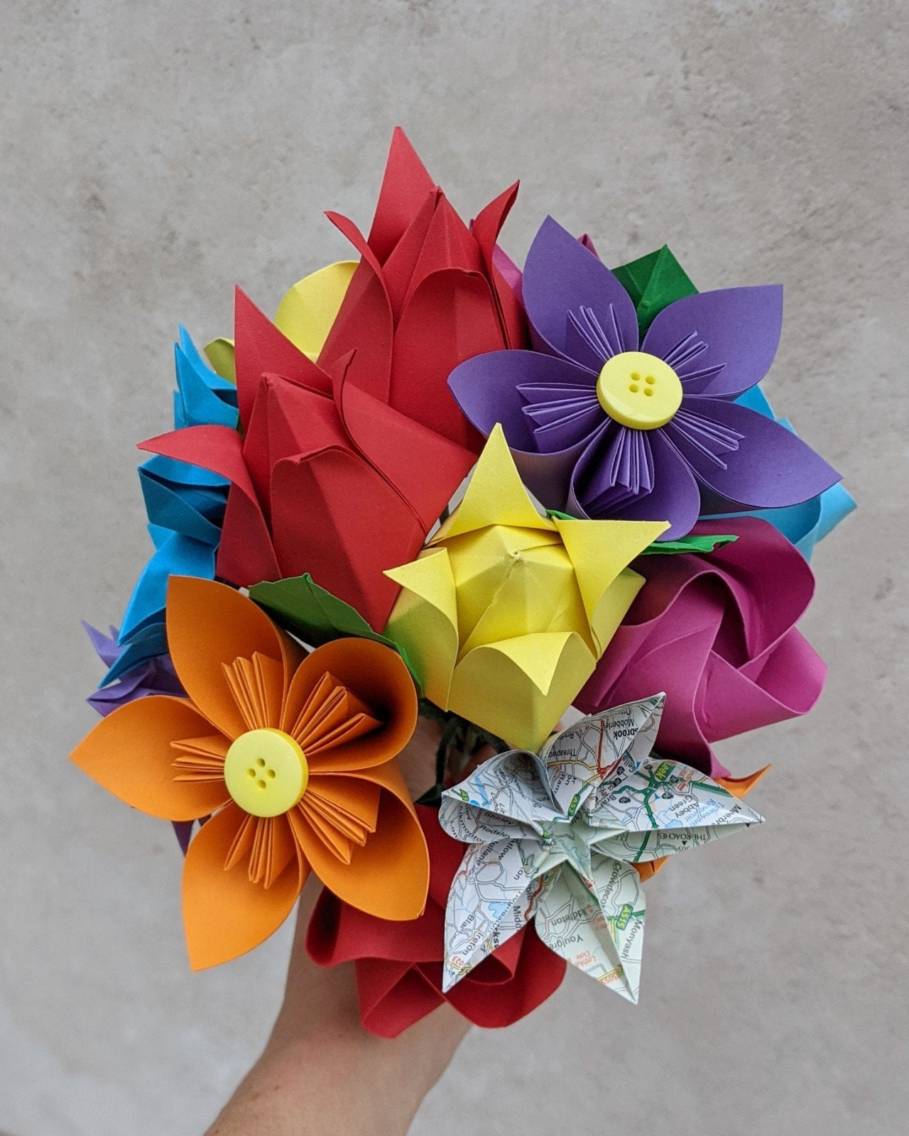 Colourful origami wedding bouquet with upcycled map paper flowers