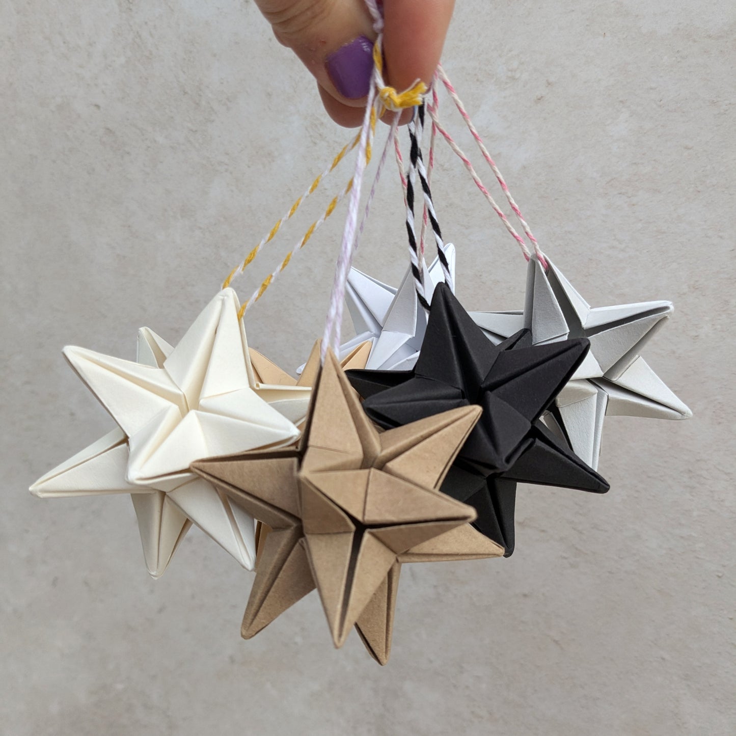 Handmade neutral paper star bauble, origami Christmas decoration