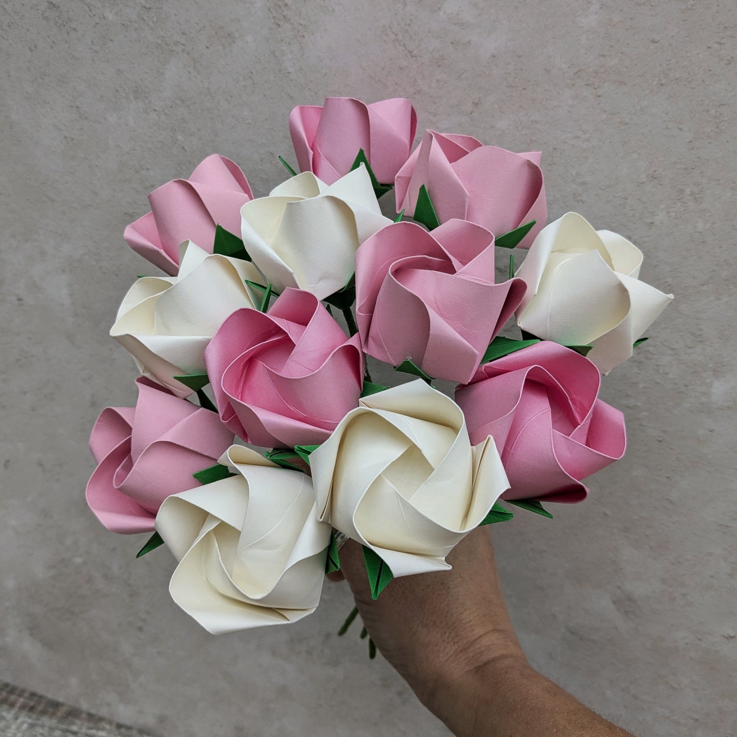 bouquet of one dozen pastel pink and ivory origami paper roses