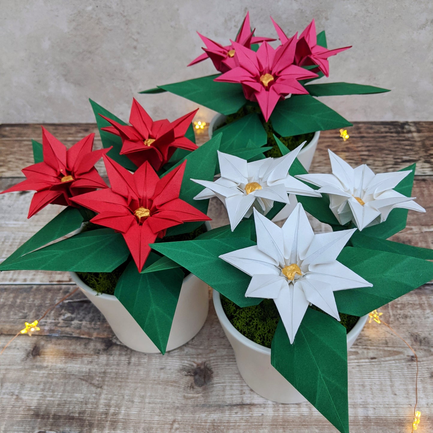 Pink origami paper plant, faux poinsettia in pot