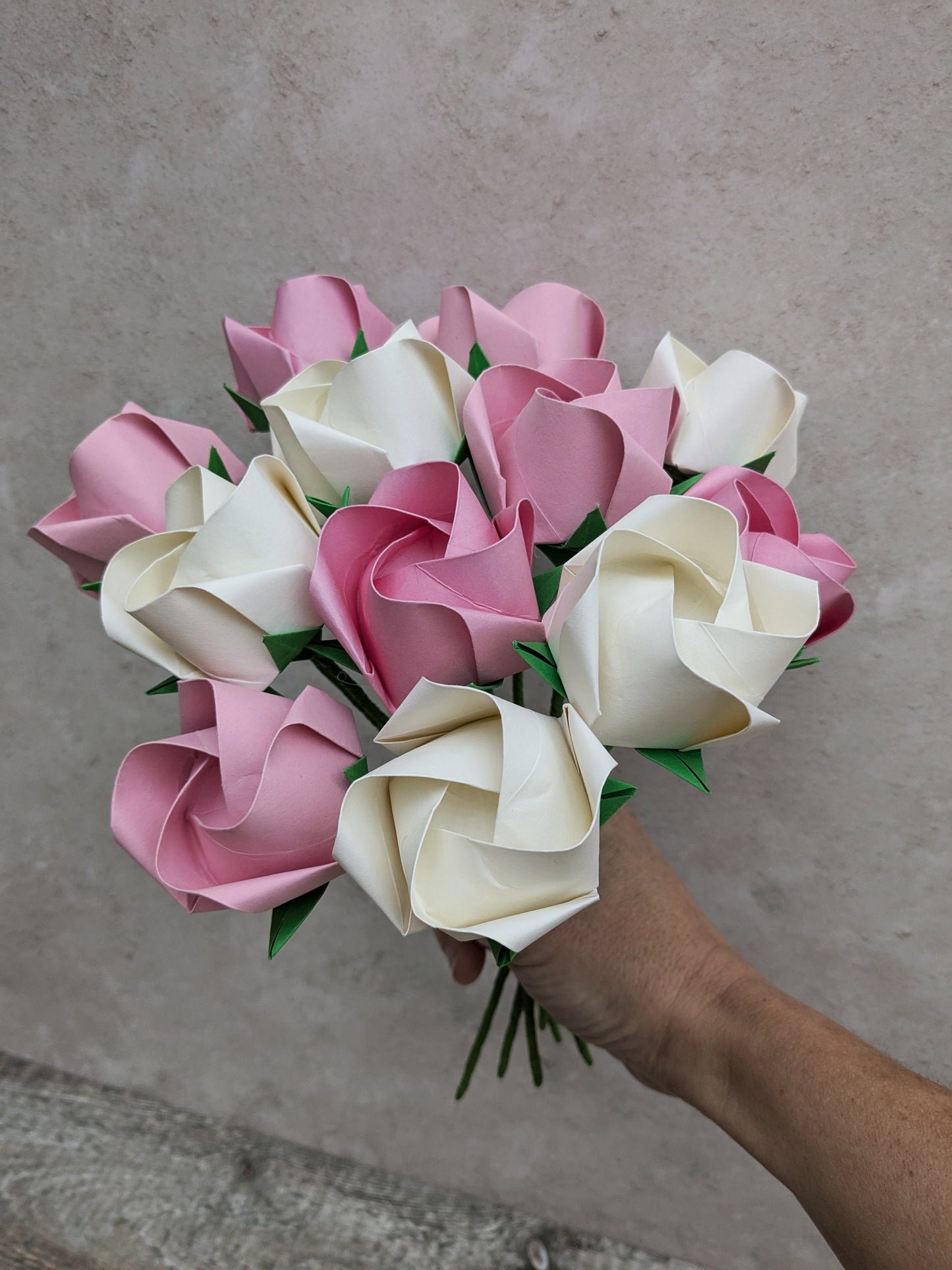 A dozen pastel paper roses, origami flowers bouquet