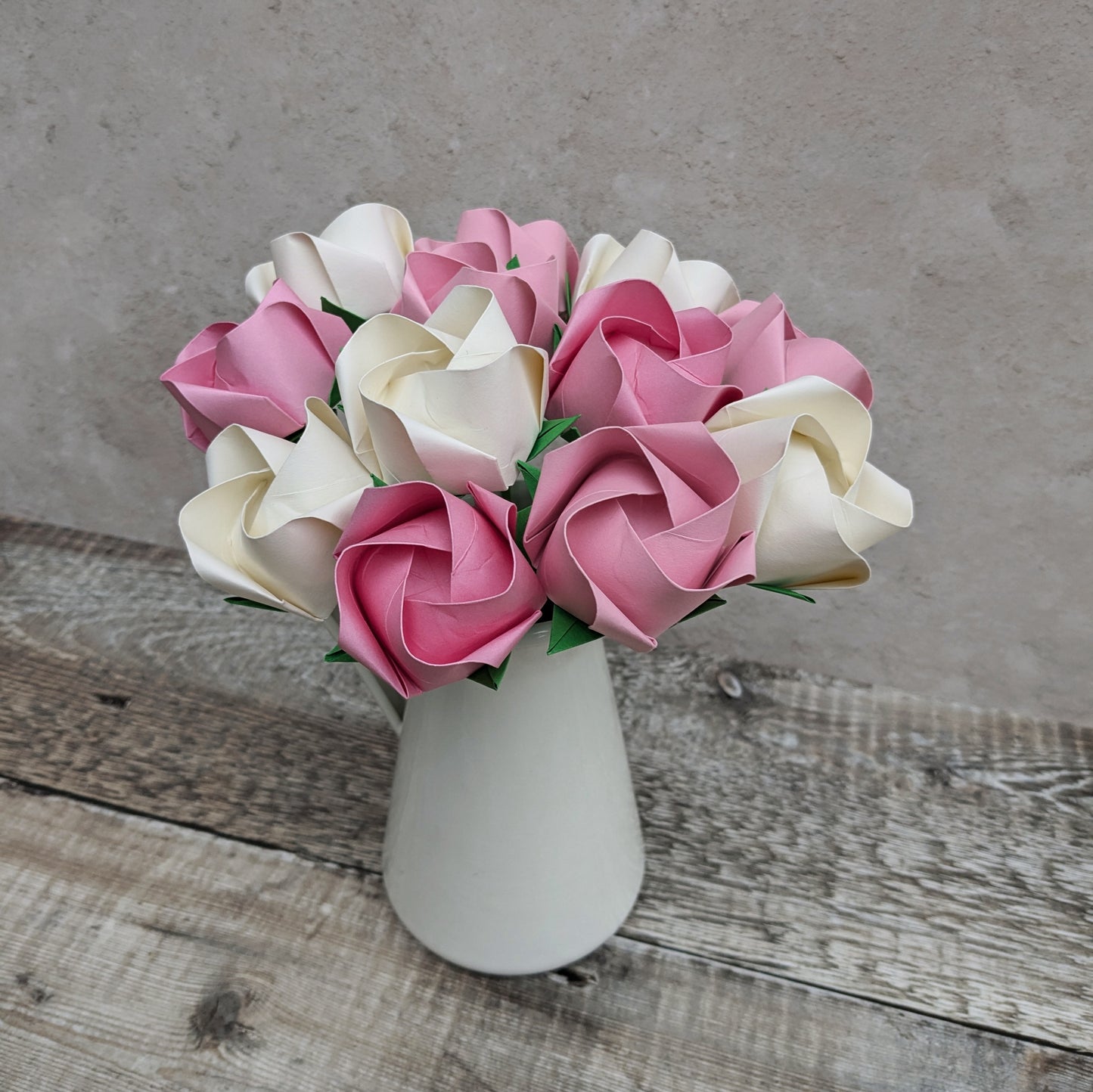 A dozen pastel paper roses, origami flowers bouquet