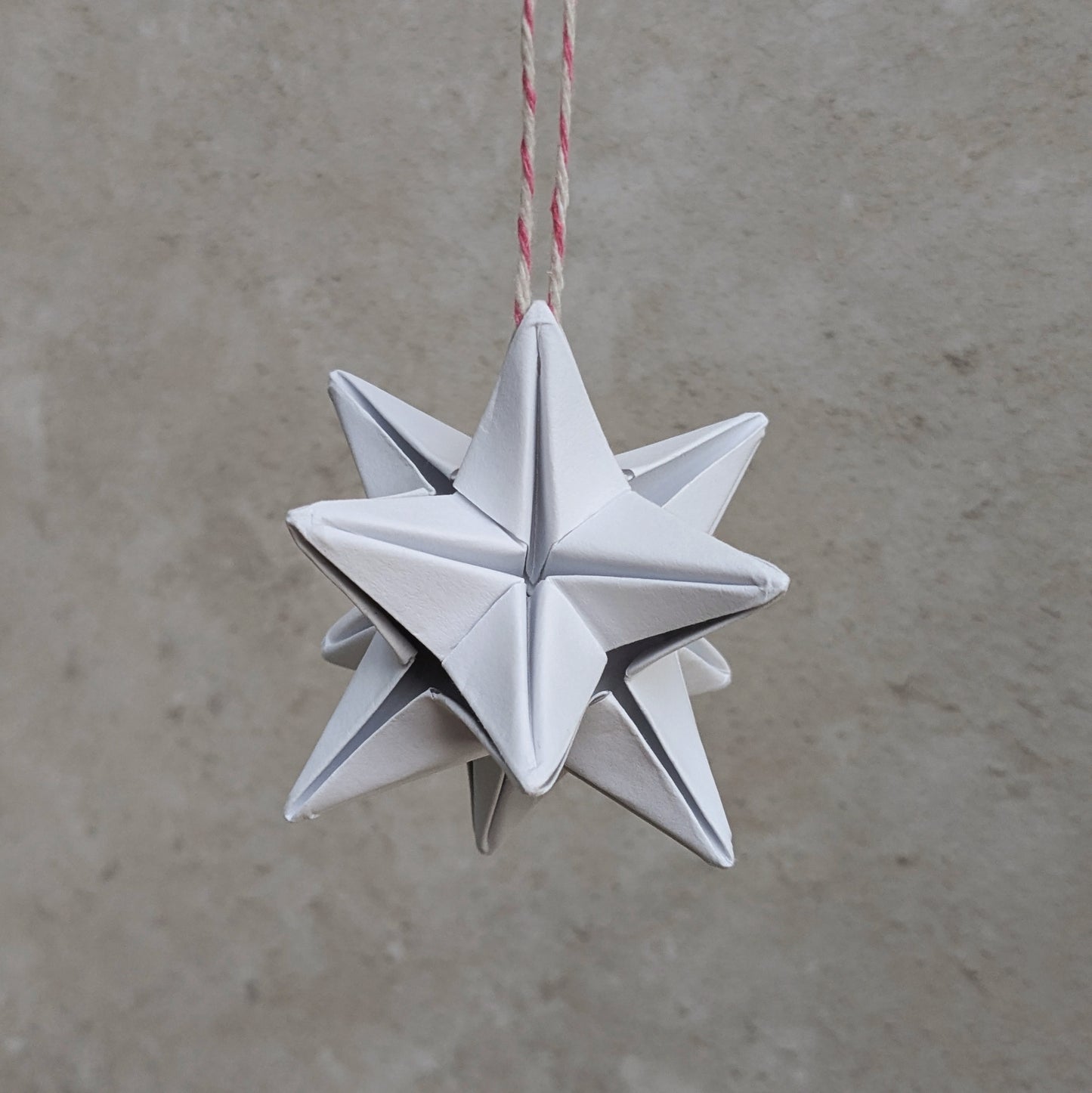 white paper origami star bauble